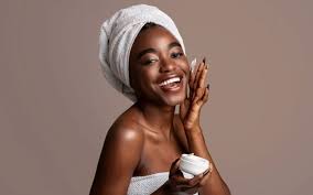 A variety of skincare products including cleansers, moisturizers, and serums arranged neatly on a vanity, representing a comprehensive skincare routine for achieving radiant and healthy skin.